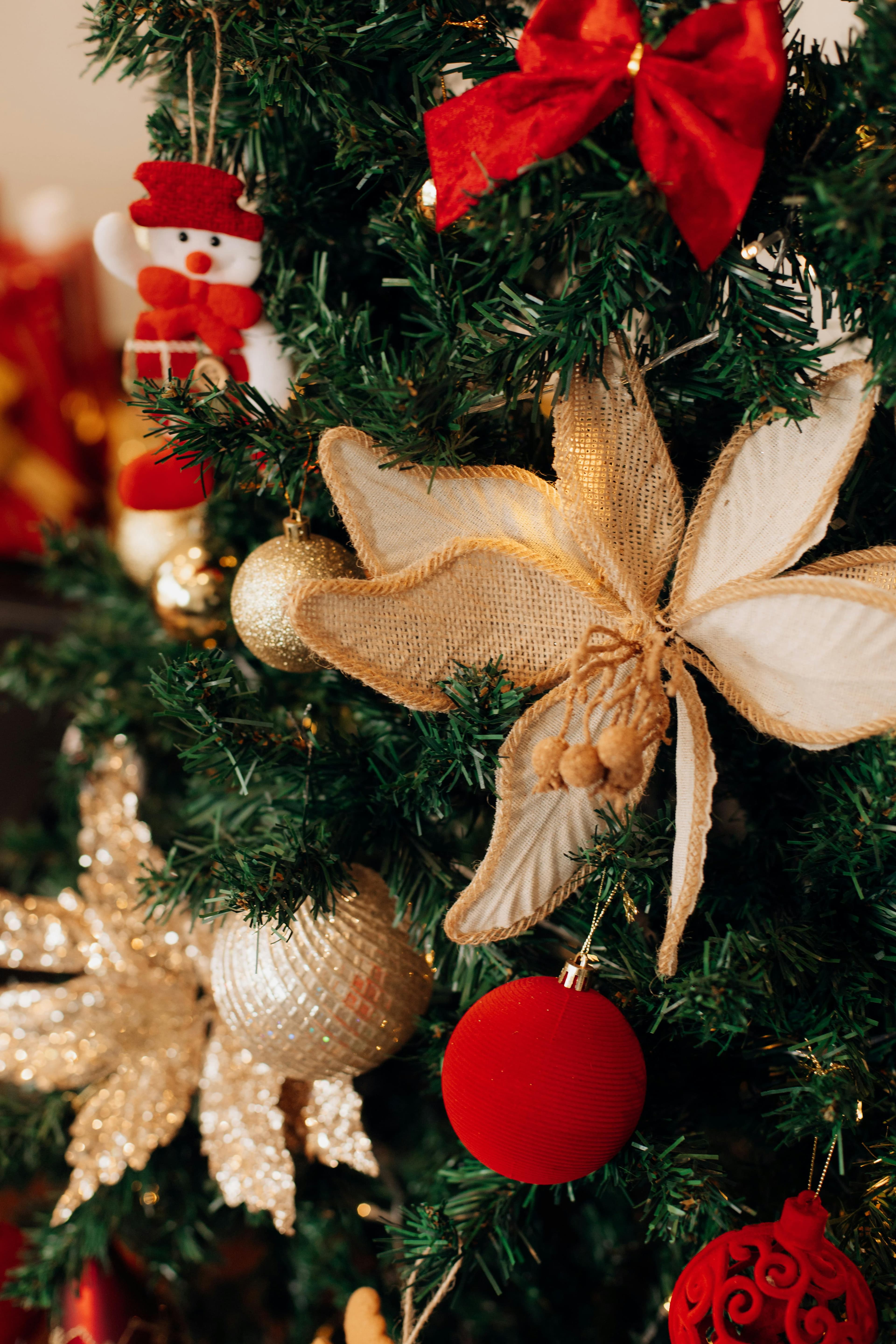 A beautifully decorated Christmas tree adorned with various ornaments and festive decorations.