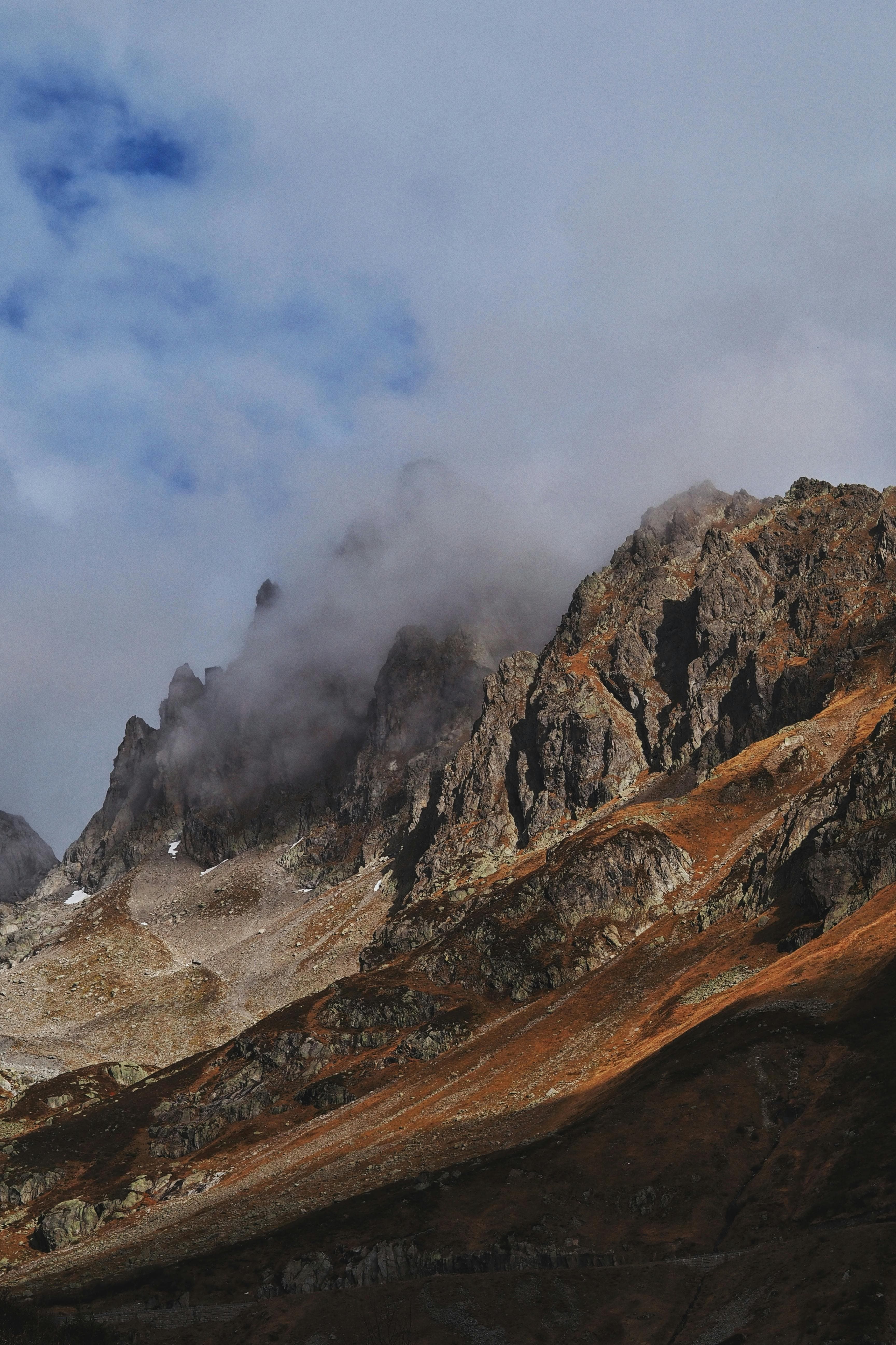Capture of rugged mountain peaks and clouds in Innertkirchen, Bern, Switzerland.
