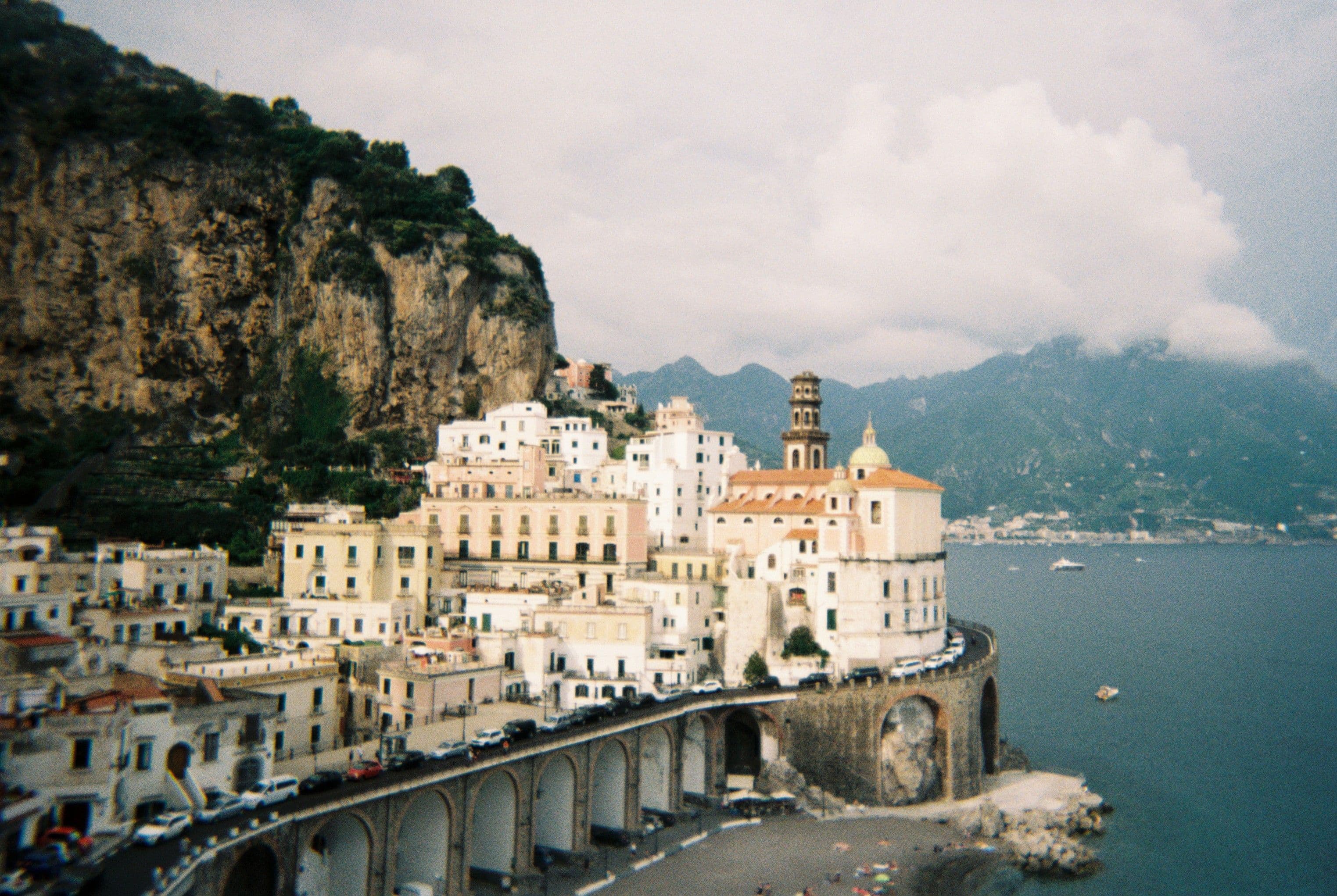 Beautiful view of a coastal town, nestled on cliffs of the Amalfi Coast, Italy.